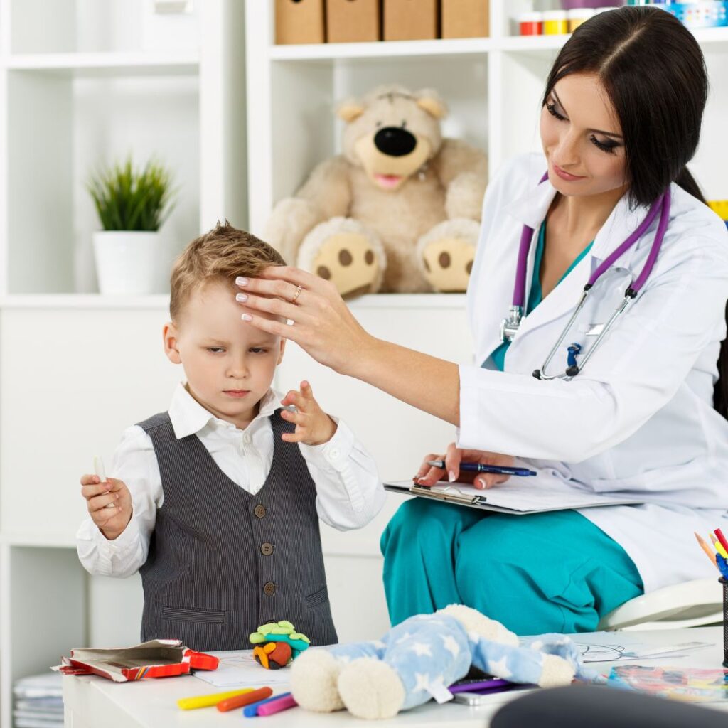 Child receiving speech therapy with a paediatric therapist